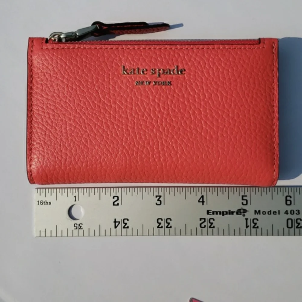 Kate Spade Leather Roulette Small Slim Bifold Wallet. Color: Peachmelba.